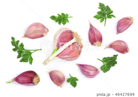 garlic with parsley leaves isolated on white background. Top view. Flat lay pattern garlic with parsley leaves isolated on white background. Top view. Flat lay pattern 46427699
