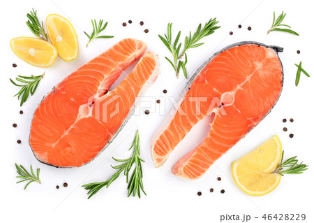 Slice of red fish salmon with lemon, rosemary and peppercorns isolated on white background. Top view Slice of red fish salmon with lemon, rosemary and peppercorns isolated on white background. Top view 46428229