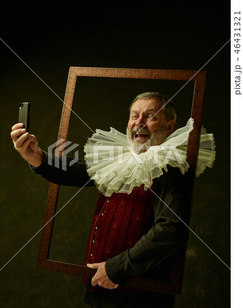 Official portrait of historical governor from the golden age. Studio shot against dark wall. Official portrait of historical governor from the golden age. Studio shot against dark wall. 46431321