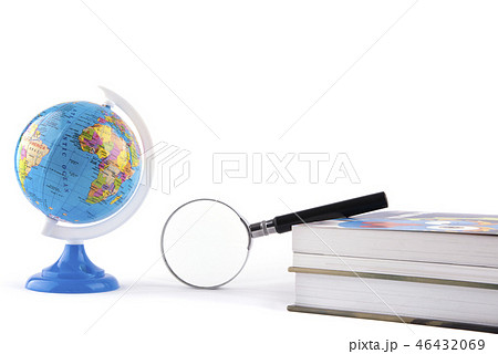 Globe witn magnifying glass on book isolated over  46432069
