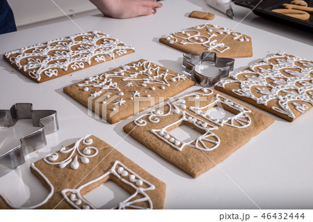 Cooking gingerbread cookies from dough.  46432444