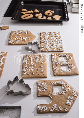 Cooking gingerbread cookies from dough.  46432446