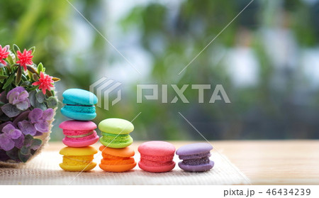 Pile of french colorful macarons on table. Pile of french colorful macarons on table. 46434239