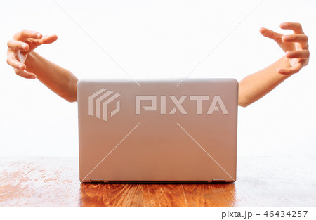 Hands that come out of the computer, the concept Hands that come out of the computer, the concept 46434257