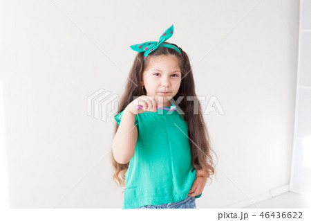 little girl with out a tooth with a toothbrush dent little girl with out a tooth with a toothbrush dent 46436622
