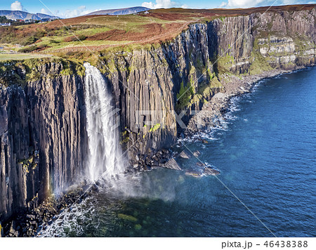 Aerial view of the dramatic coastline at the cliffs by Staffin with the famous Kilt Rock waterfall - 46438388