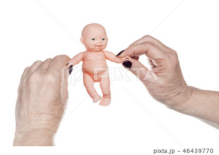senile female hands playing doll 46439770