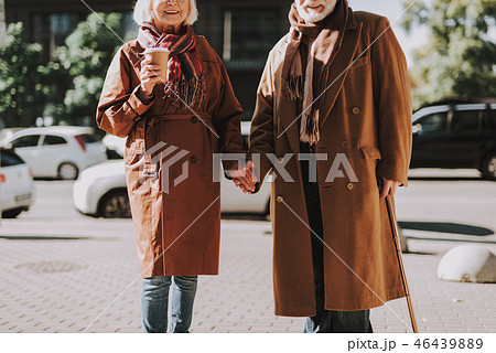 Beautiful elderly couple holding hands on the street 46439889