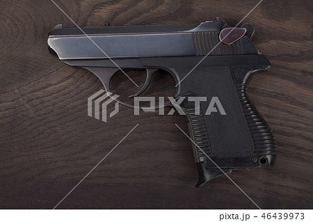 handgun on the wooden table 46439973