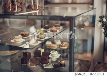 laconic image of lovely cupcakes places in the glass case in cafe laconic image of lovely cupcakes places in the glass case in cafe 46440851