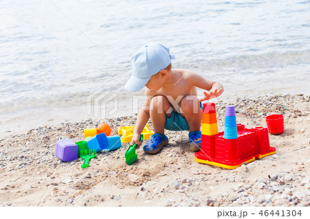 Close view of small boy having fun on a sandy beach 46441304