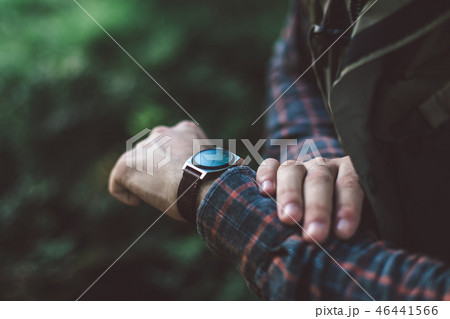 Man looking at his watch to be in time 46441566