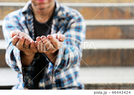 Close up hand of homeless man on walking street. Close up hand of homeless man on walking street. 46443424