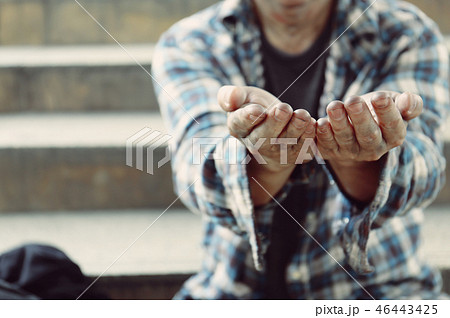 Close up hand of homeless man on walking street. Close up hand of homeless man on walking street. 46443425
