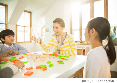 Young Students Learning English With A Foreign Female Teacher Young Students Learning English With A Foreign Female Teacher 46443936