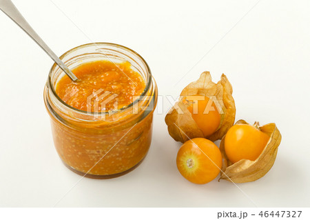 Golden berry jam in glass jar on white Golden berry jam in glass jar on white 46447327