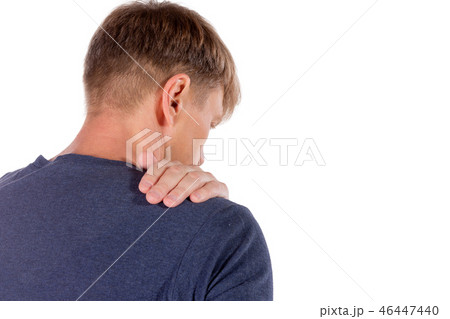 Man holding his sore shoulder trying to relieve Man holding his sore shoulder trying to relieve 46447440