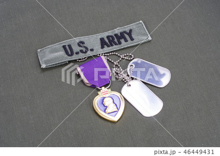 Purple Heart award on US ARMY green uniform Purple Heart award on US ARMY green uniform 46449431