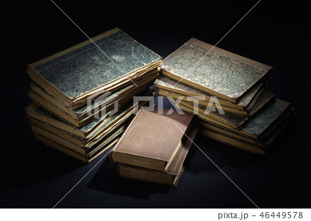 old books, papers, ink pen and inkpot on black  46449578