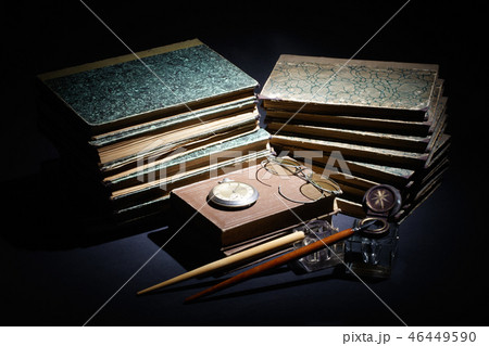 old books, papers, ink pen and inkpot on black  46449590