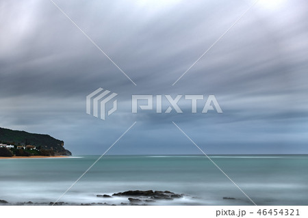 Ultra long exposure of ocean with stormy clouds and cape 46454321