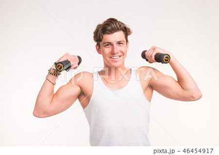 Sport, fitness and people concept - handsome athletic man with dumbbells on white background Sport, fitness and people concept - handsome athletic man with dumbbells on white background 46454917