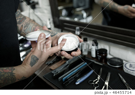 Tools for cutting beard barbershop top view. Vintage tools of barber shop on wooden background Tools for cutting beard barbershop top view. Vintage tools of barber shop on wooden background 46455714