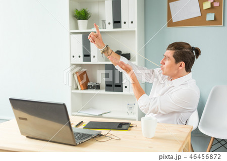 Business people, fools and fun concept - portrait of caucasian man stretching bubble gum from mouth 46456872