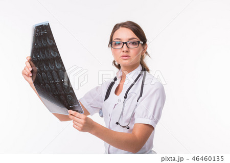 Woman holding MRI brain film to see for diagnostic and report on white background. Medical, doctor Woman holding MRI brain film to see for diagnostic and report on white background. Medical, doctor 46460135