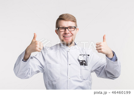 Portrait of white happy male doctor with thumb up wearing glasses 46460199