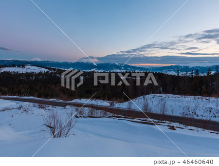 Evening twilight winter mountain ridge panorama Evening twilight winter mountain ridge panorama 46460640