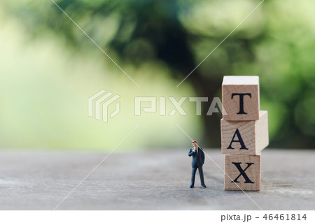 Miniature people businessmen standing with wood Miniature people businessmen standing with wood 46461814
