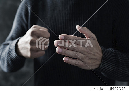 young man with a threatening gesture young man with a threatening gesture 46462395