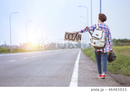 girl with a guitar hitch-hiking girl with a guitar hitch-hiking 46465033