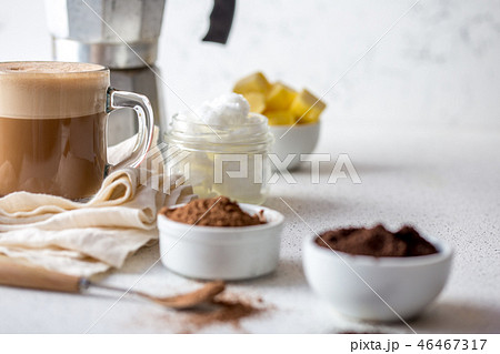 KETOGENIC KETO DIET DRINK. Coffe and cacao blended with coconut oil. Cup of bulletproof coffe with KETOGENIC KETO DIET DRINK. Coffe and cacao blended with coconut oil. Cup of bulletproof coffe with 46467317
