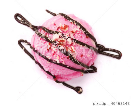 Strawberry ice cream ball with melted chocolate and nuts isolated on white background, top view 46468148