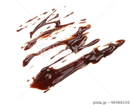 Hot melted chocolate pouring isolated on white background, top view 46468150