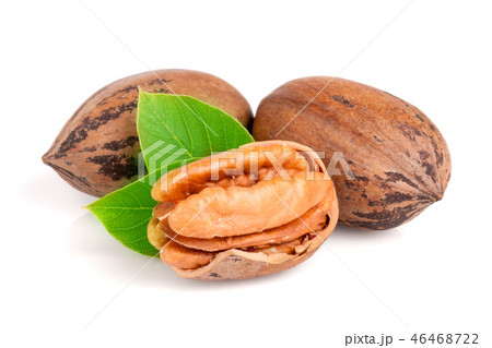 Three pecan with leaves isolated on white background 46468722