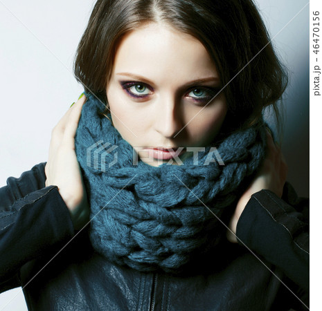 young pretty real woman in sweater and scarf all over her face s 46470156