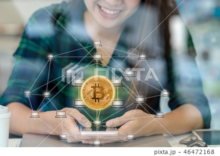 Closeup Asian businesswoman hand using the smart mobile phone with Bitcoins mockup and Distributed computer network hologram in workplace co-working space,blockchain and bitcoin concept Closeup Asian businesswoman hand using the smart mobile phone with Bitcoins mockup and Distributed computer network hologram in workplace co-working space,blockchain and bitcoin concept 46472168