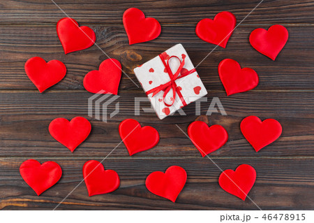 holiday handmade present in paper with red hearts holiday handmade present in paper with red hearts 46478915