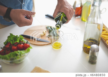 Man preparing ingredients for vegetable salad 46480850
