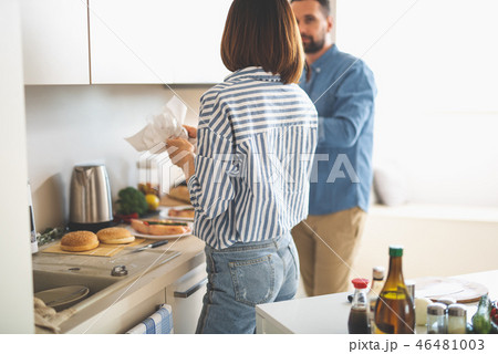 Young couple preparing for romantic dinner in kitchen 46481003
