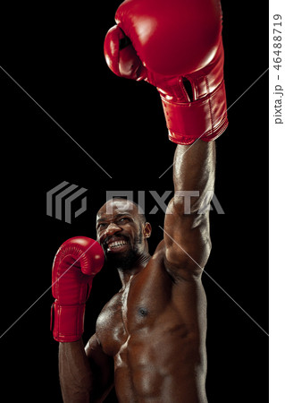Hand of boxer over black background. Strength, attack and motion concept Hand of boxer over black background. Strength, attack and motion concept 46488719