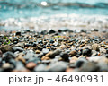 Waves washing over gravel beach, macro shot with narrow focus background 46490931