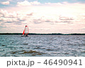 Boat sailing in the lake with a beautiful sky 46490941