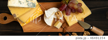 Various types of cheese on a rustic table Various types of cheese on a rustic table 46491354