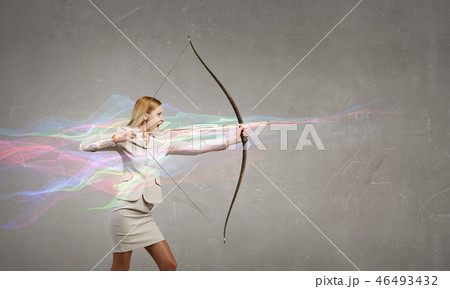 Woman aiming her goal Woman aiming her goal 46493432