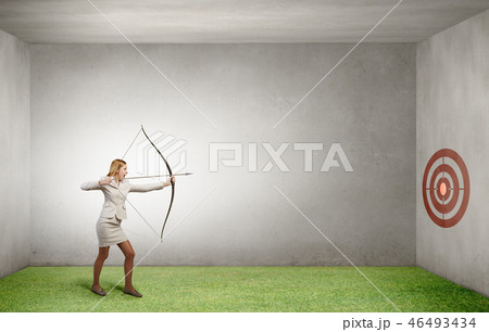 Woman aiming her goal Woman aiming her goal 46493434