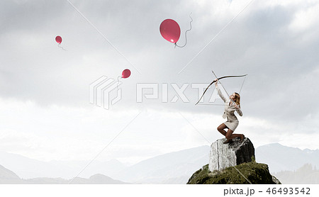 Woman aiming her goal Woman aiming her goal 46493542